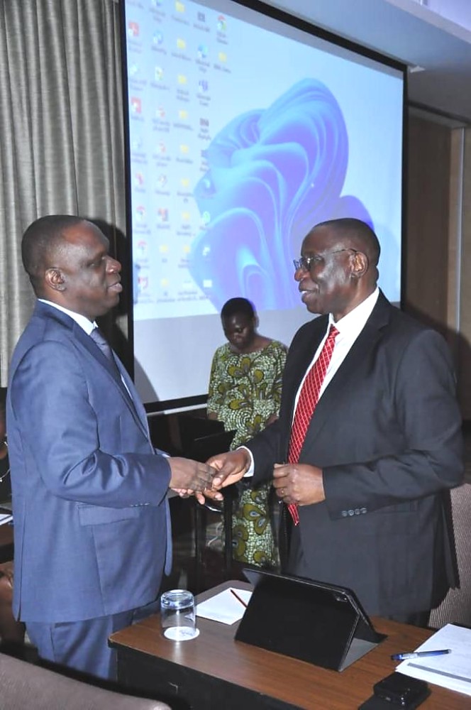 Ambassadors Mbelwa Kairuki (China) and Dr. Benson Bana (Nigeria) exchanging greetings on the margins of the meeting.