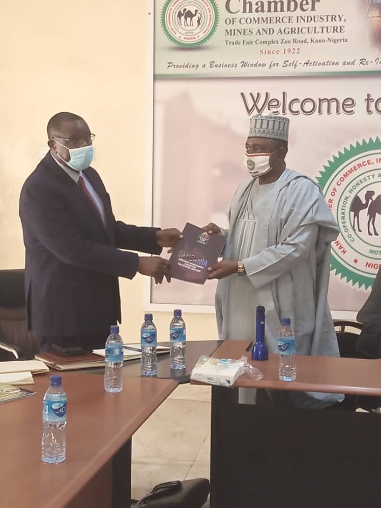 The High Commissioner, H. E Dr. Benson Alfred Bana presenting Tanzania Investment Opportunities and Incentive Brochure to the President of KACCIMA, Alh. Dalhatu Abubakar.